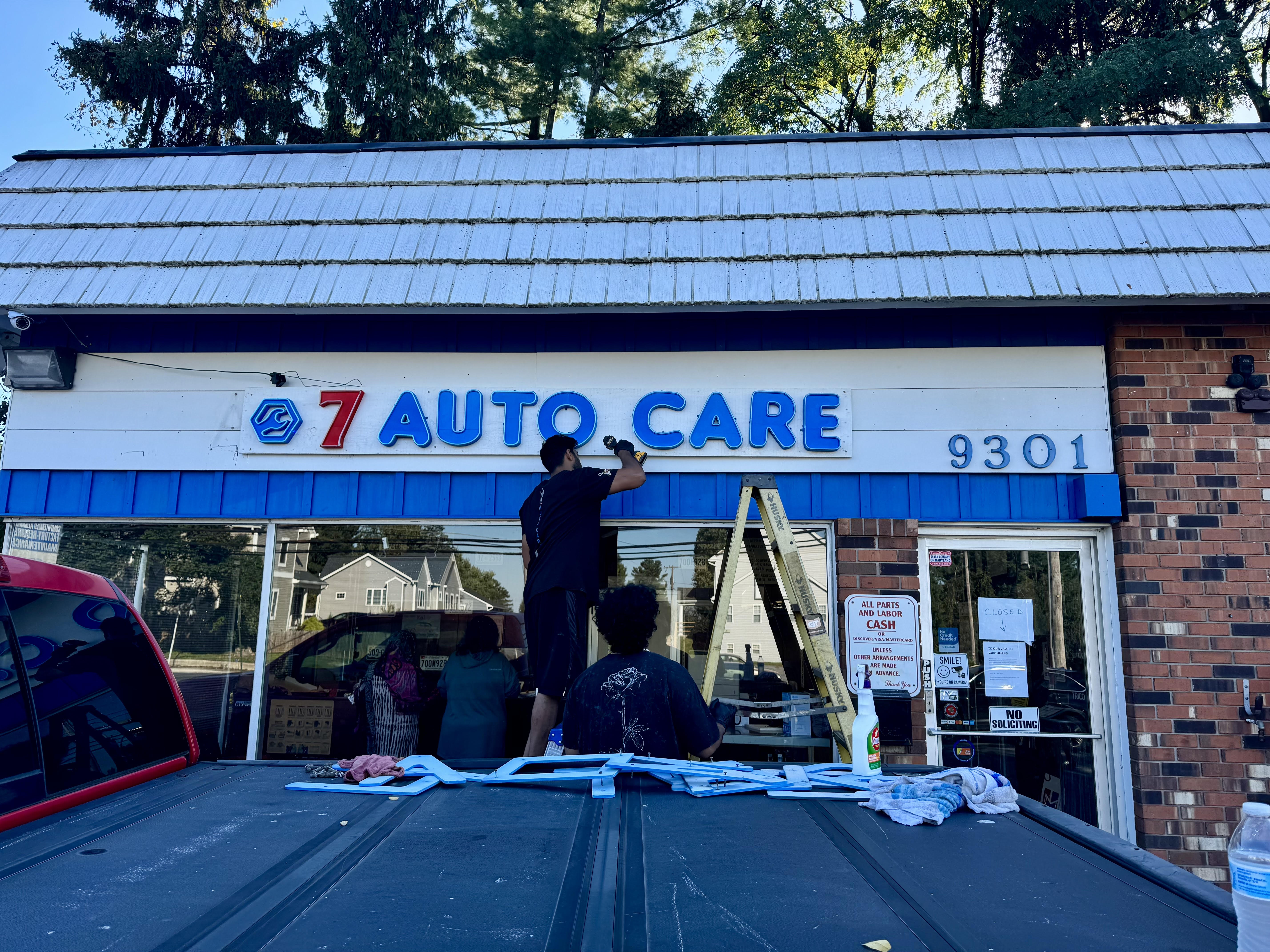 The 7 Auto Care core team in the Randallstown service bays